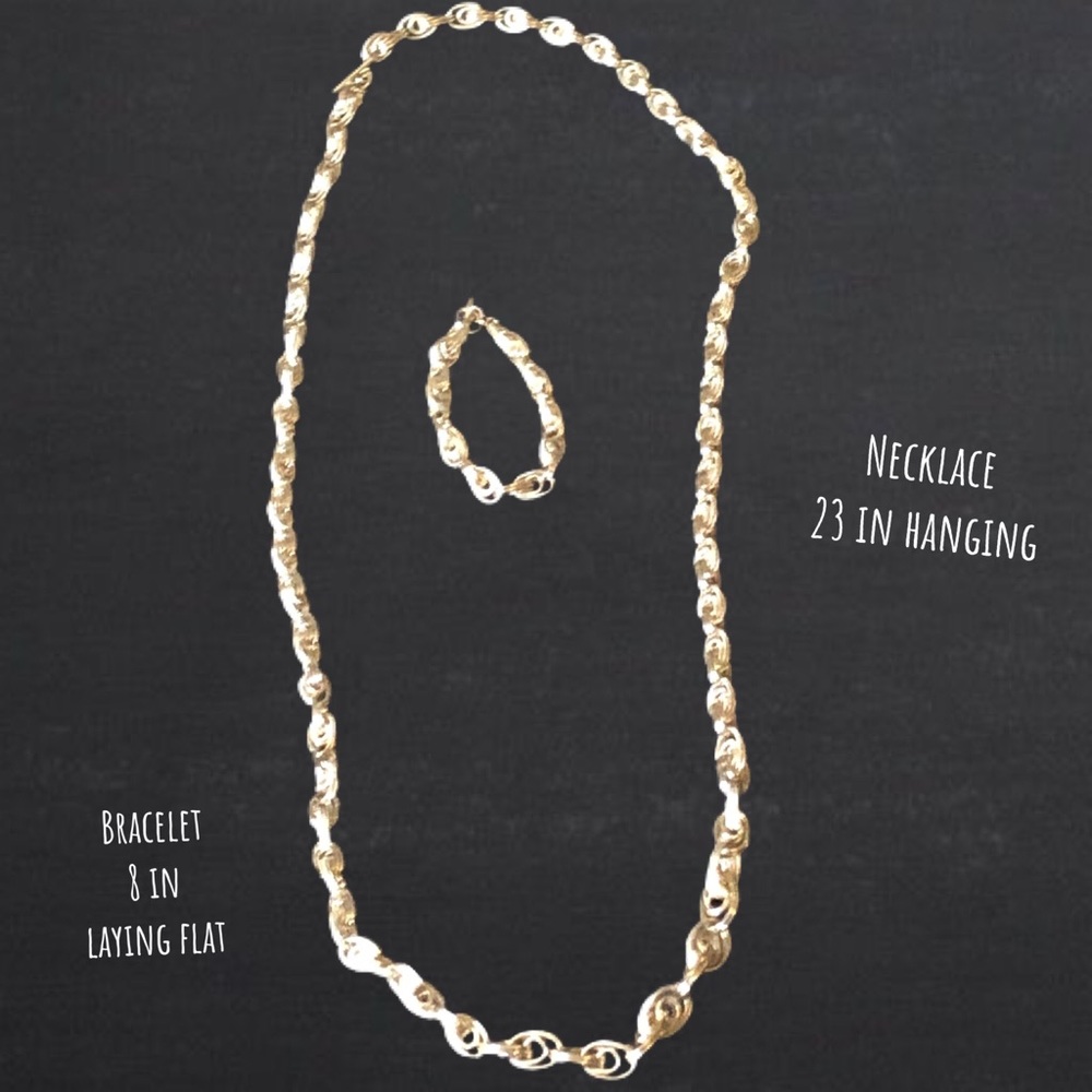 Silver tone long necklace with matching bracelet.